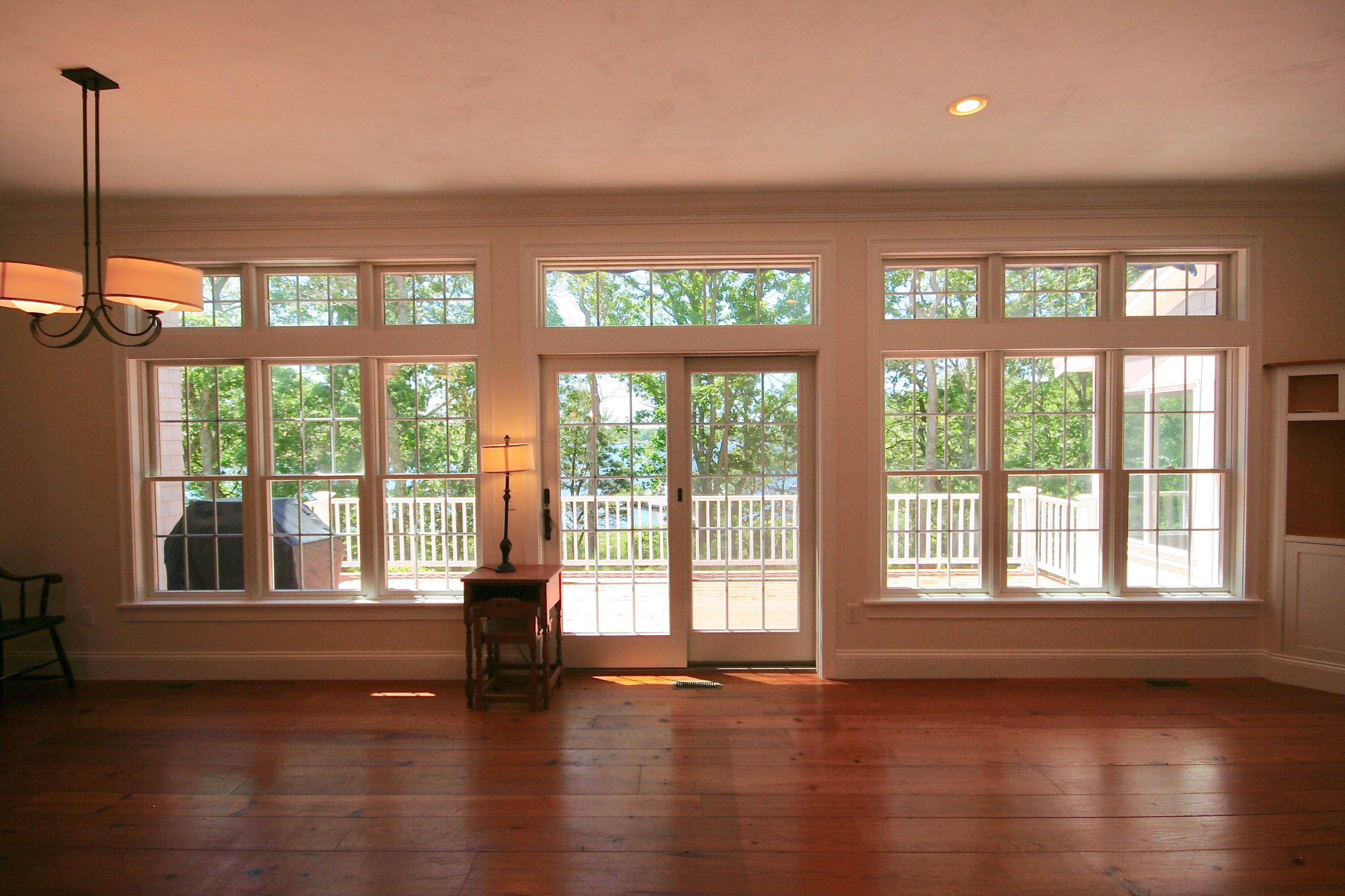5 Point Road Mashpee, MA 02649 - Photo 15 of 29 a view of empty room with wooden floor and floor to ceiling window