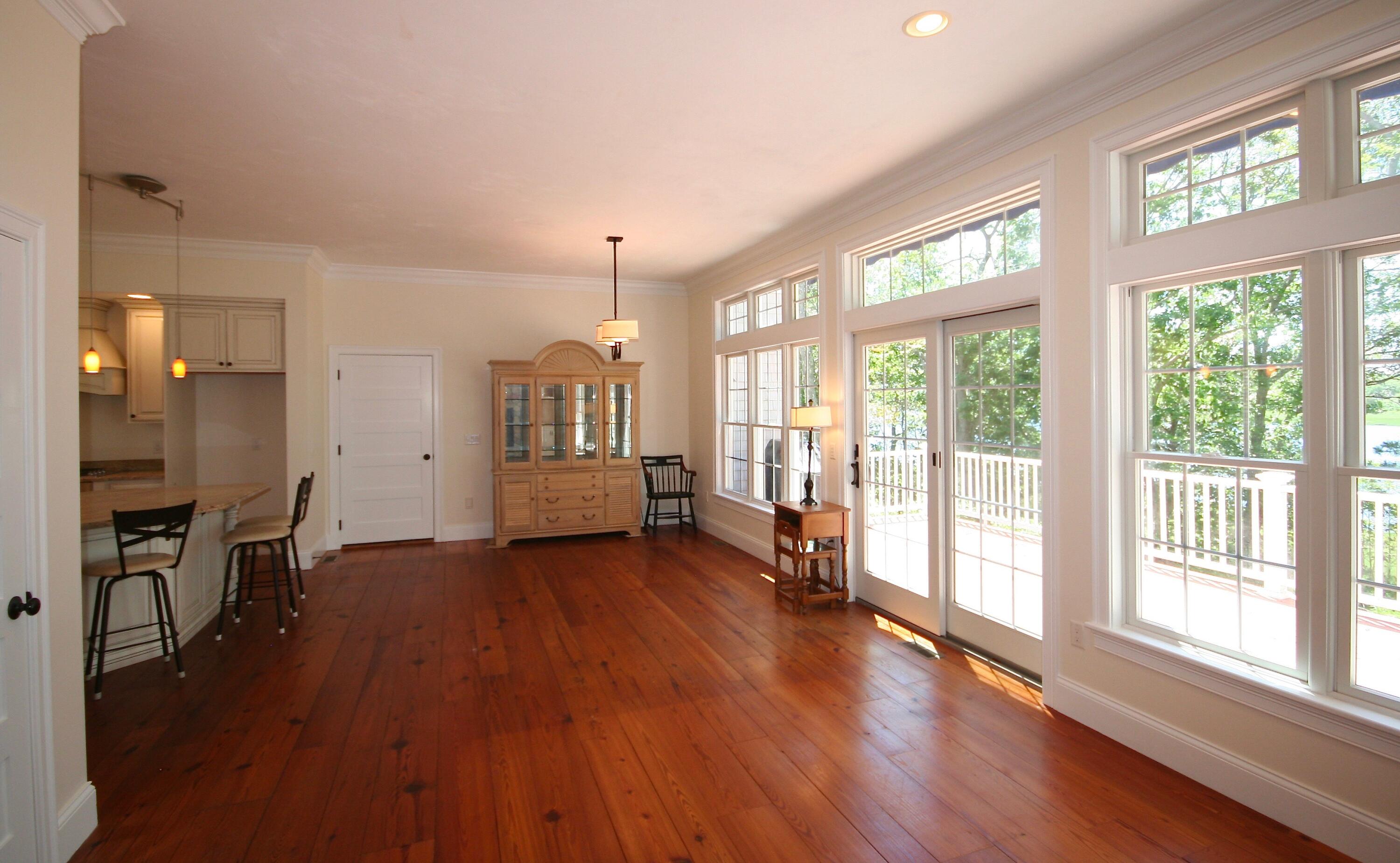 5 Point Road Mashpee, MA 02649 - Photo 16 of 29 a view of a big room with wooden floor and windows