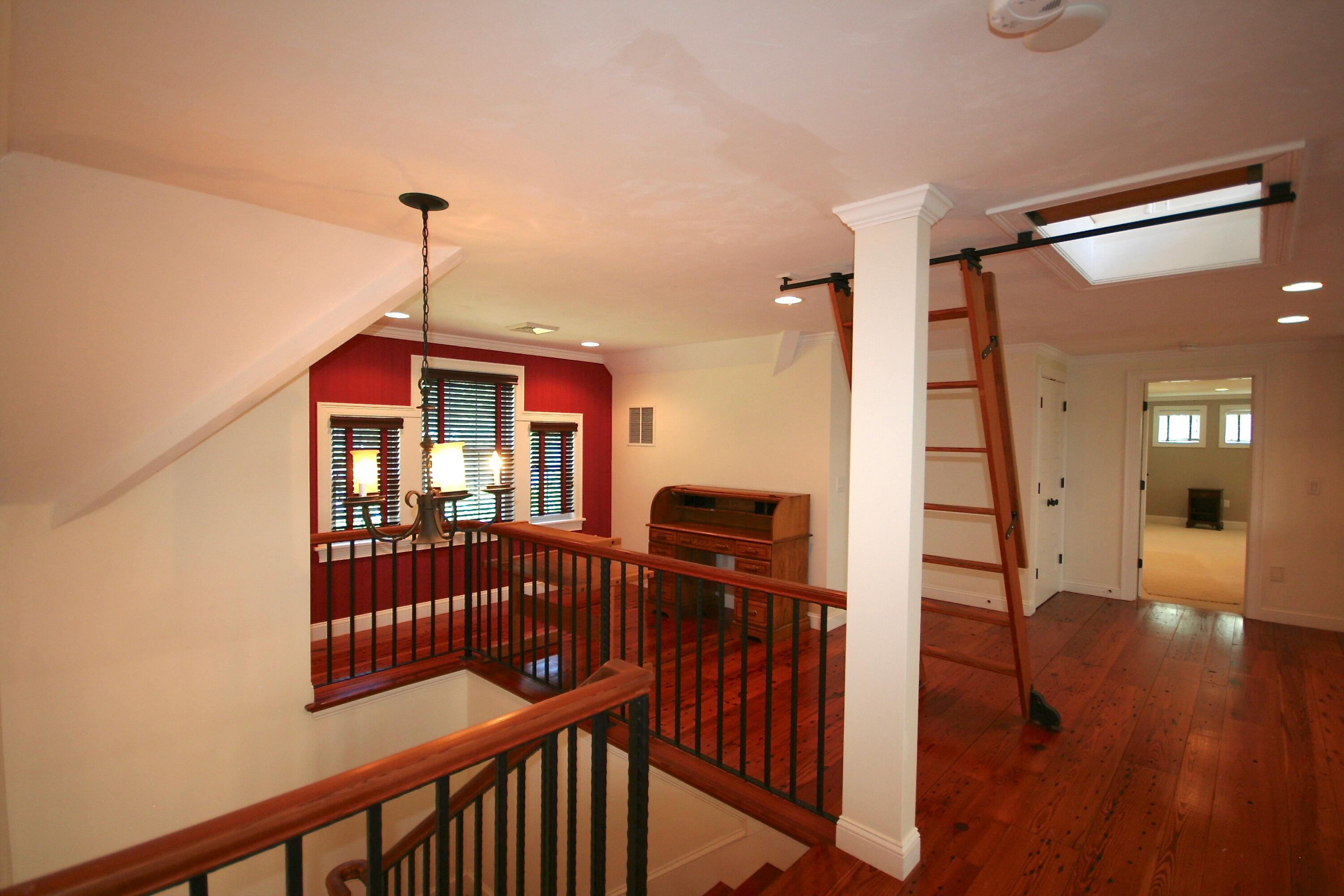 5 Point Road Mashpee, MA 02649 - Photo 23 of 29 a view of a hallway with wooden floor and stairs
