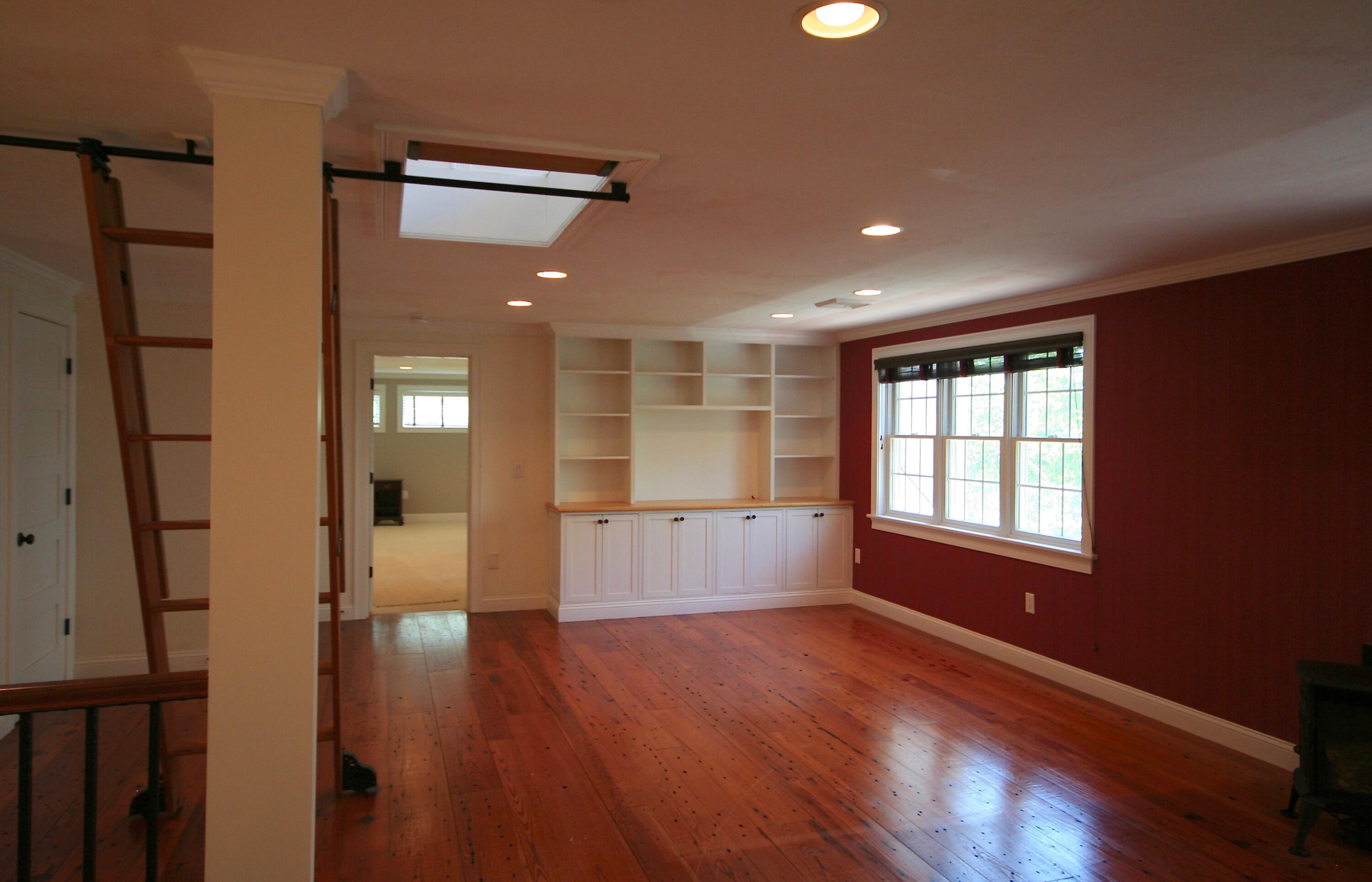 5 Point Road Mashpee, MA 02649 - Photo 24 of 29 an empty room with wooden floor and windows