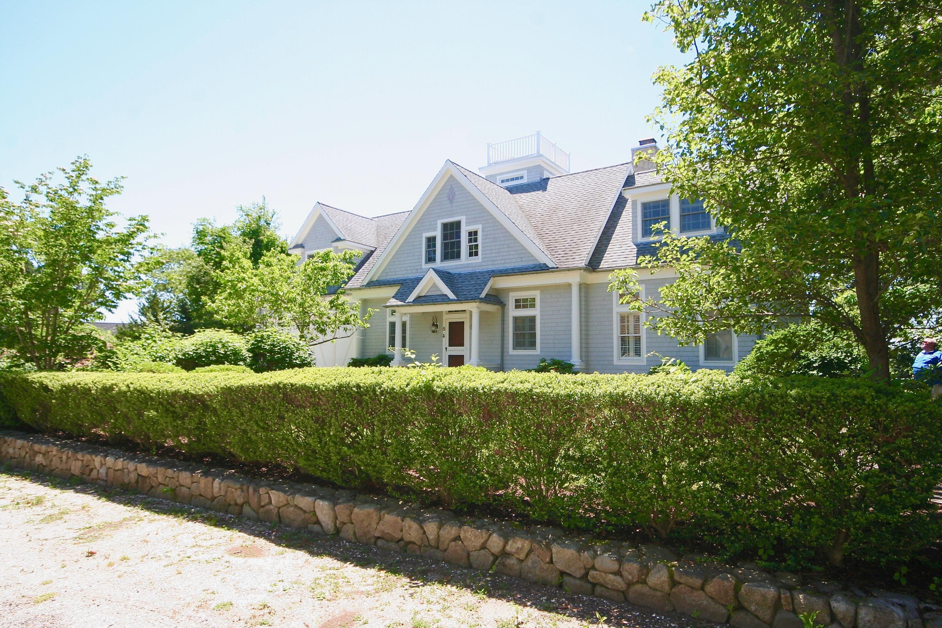 5 Point Road Mashpee, MA 02649 - Photo 4 of 29 a front view of a house with a yard