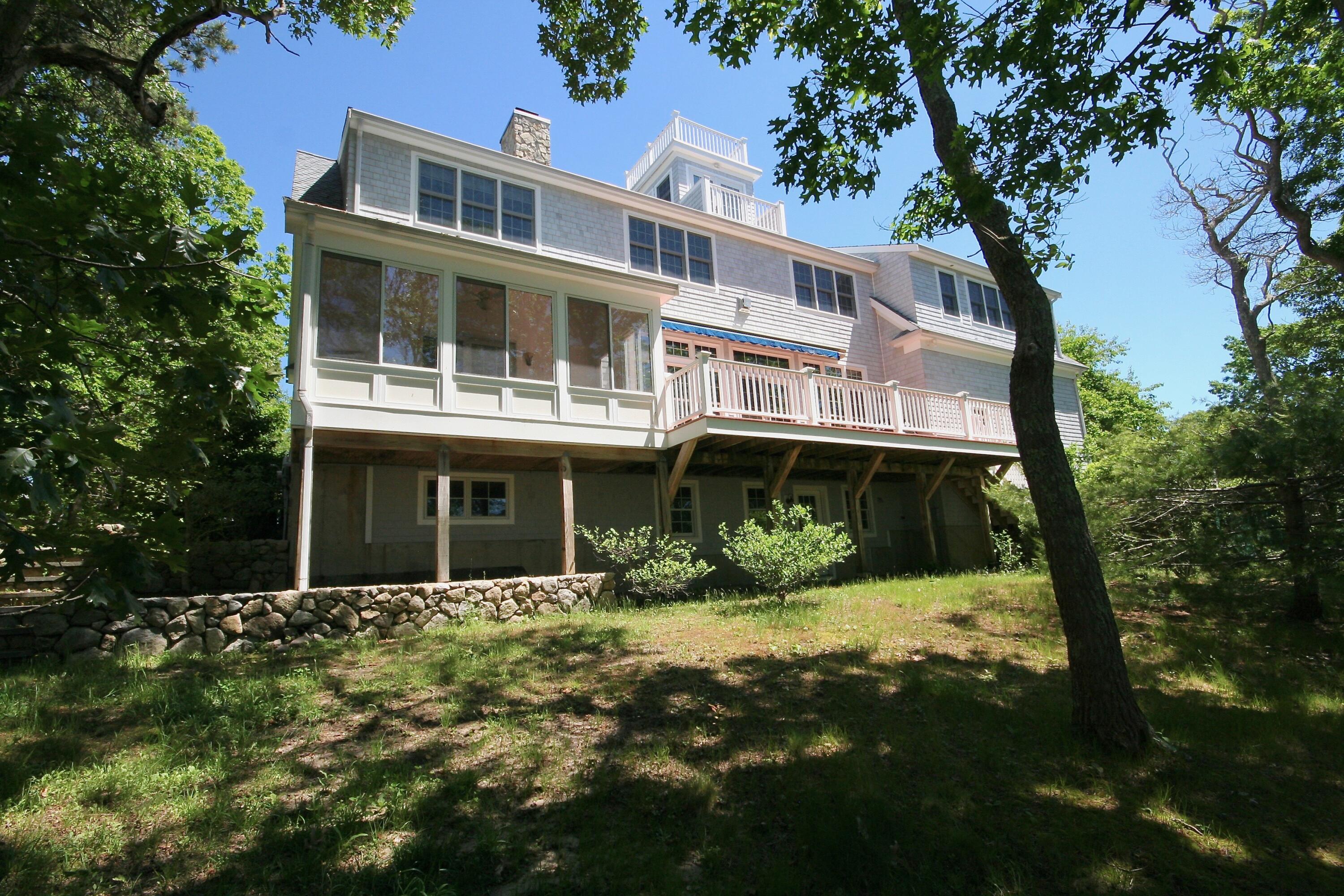 5 Point Road Mashpee, MA 02649 - Photo 9 of 29 a front view of a house with a yard