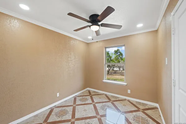 a view of an empty room and window