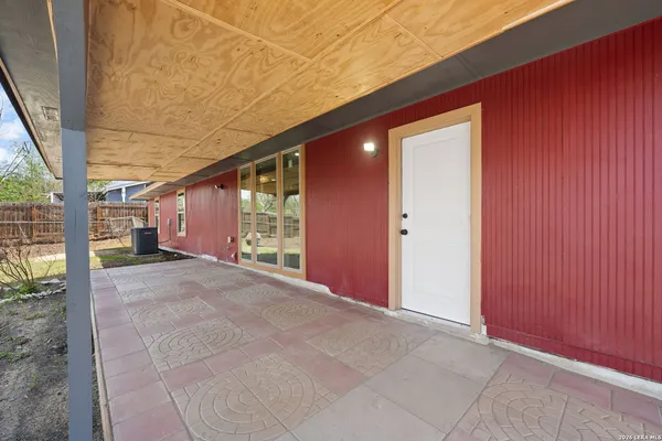 a view of an empty room with a balcony