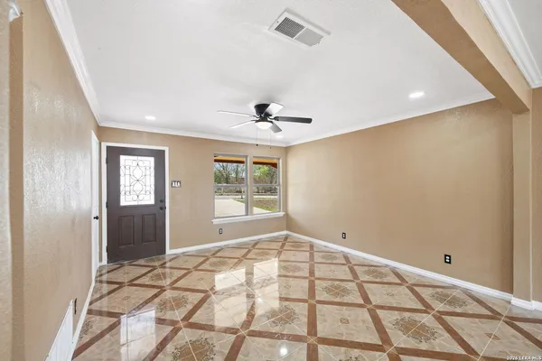 a view of an empty room and window