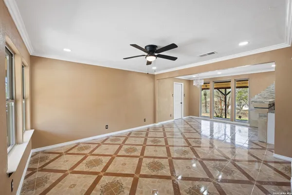a very nice looking room with a ceiling fan