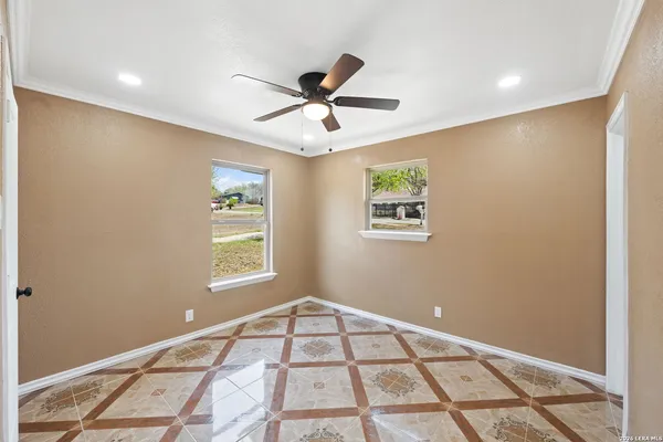 a view of an empty room with a window