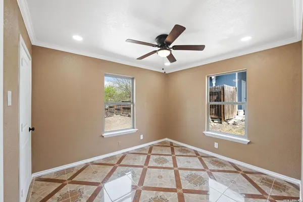 a view of an empty room with a window