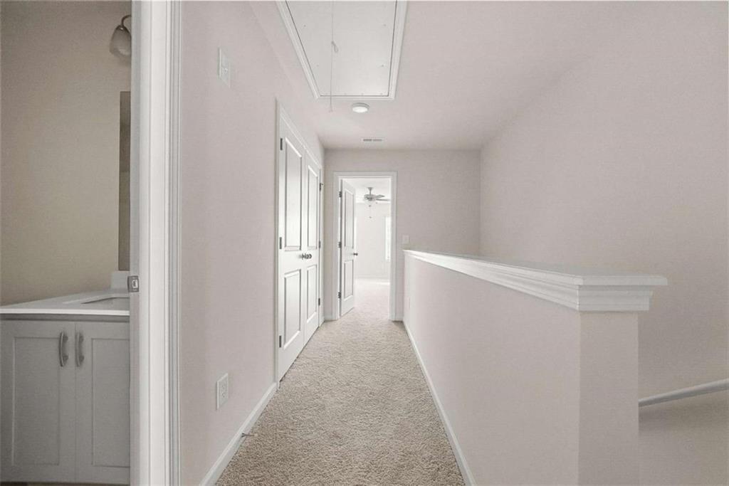 1328 Riverstone Road Jonesboro, GA 30238 - Photo 11 of 26 a view of a hallway with white walls