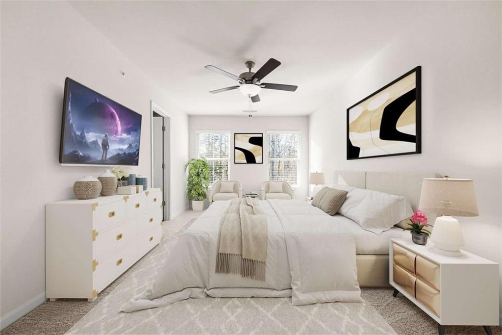 1328 Riverstone Road Jonesboro, GA 30238 - Photo 13 of 26 a bedroom with a bed and a flat screen tv