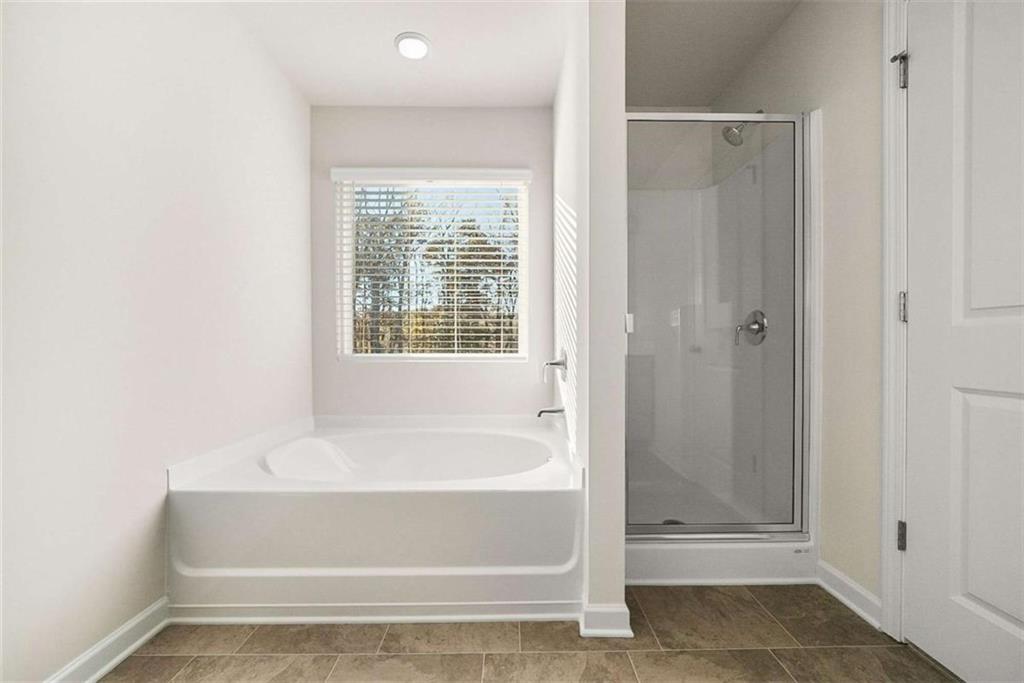 1328 Riverstone Road Jonesboro, GA 30238 - Photo 15 of 26 a bathroom with a bathtub
