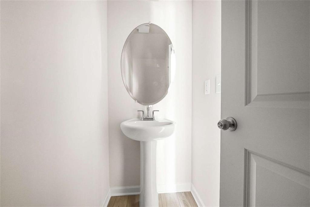 1328 Riverstone Road Jonesboro, GA 30238 - Photo 4 of 26 a bathroom with a sink and mirror