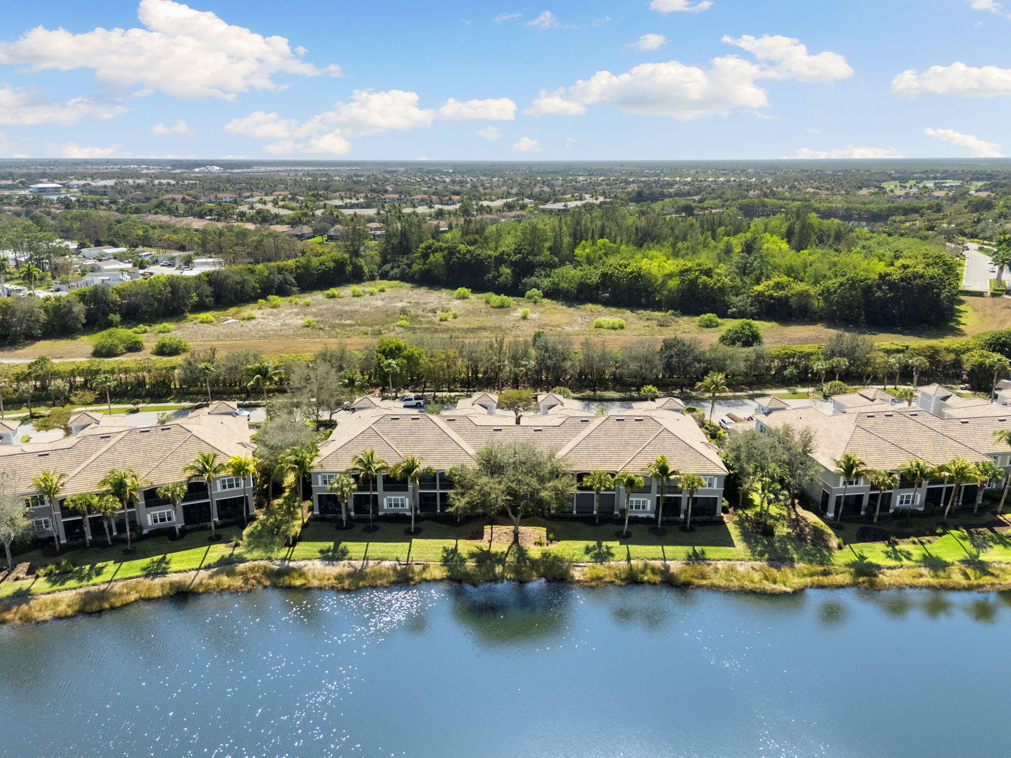 9213 Museo Circle, Unit 103 Naples, FL 34114 - Photo 31 of 47 an aerial view of residential houses with outdoor space and lake view
