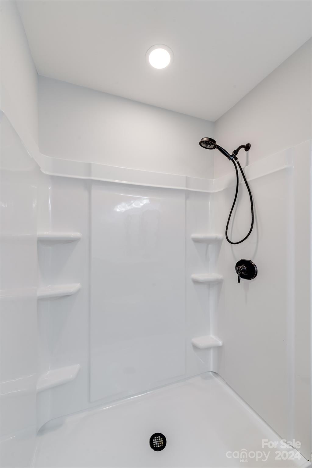 4420 Red Hook Road Monroe, NC 28110 - Photo 20 of 34 a bathroom with a glass shower door