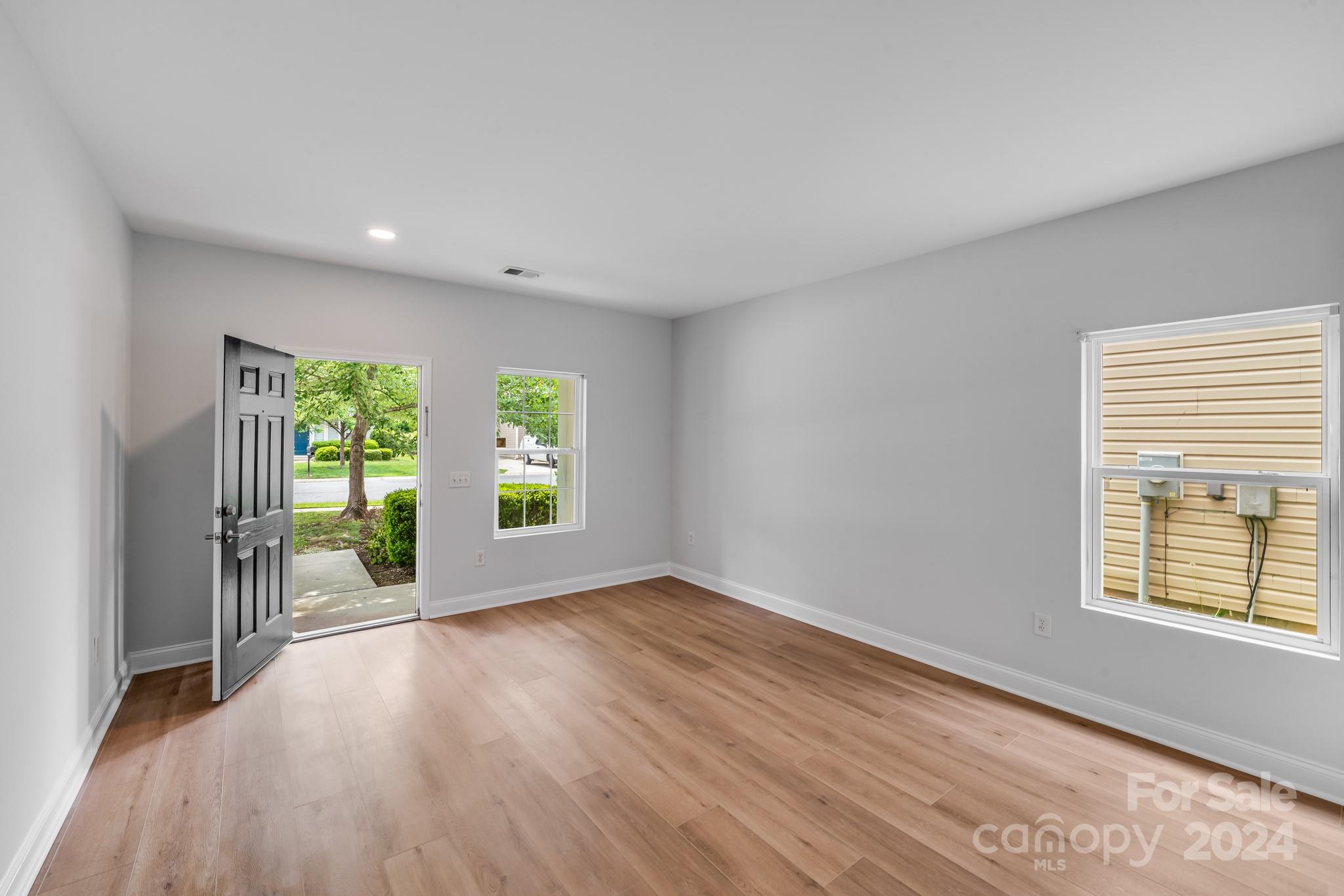 4420 Red Hook Road Monroe, NC 28110 - Photo 7 of 34 a view of an empty room with wooden floor and a window
