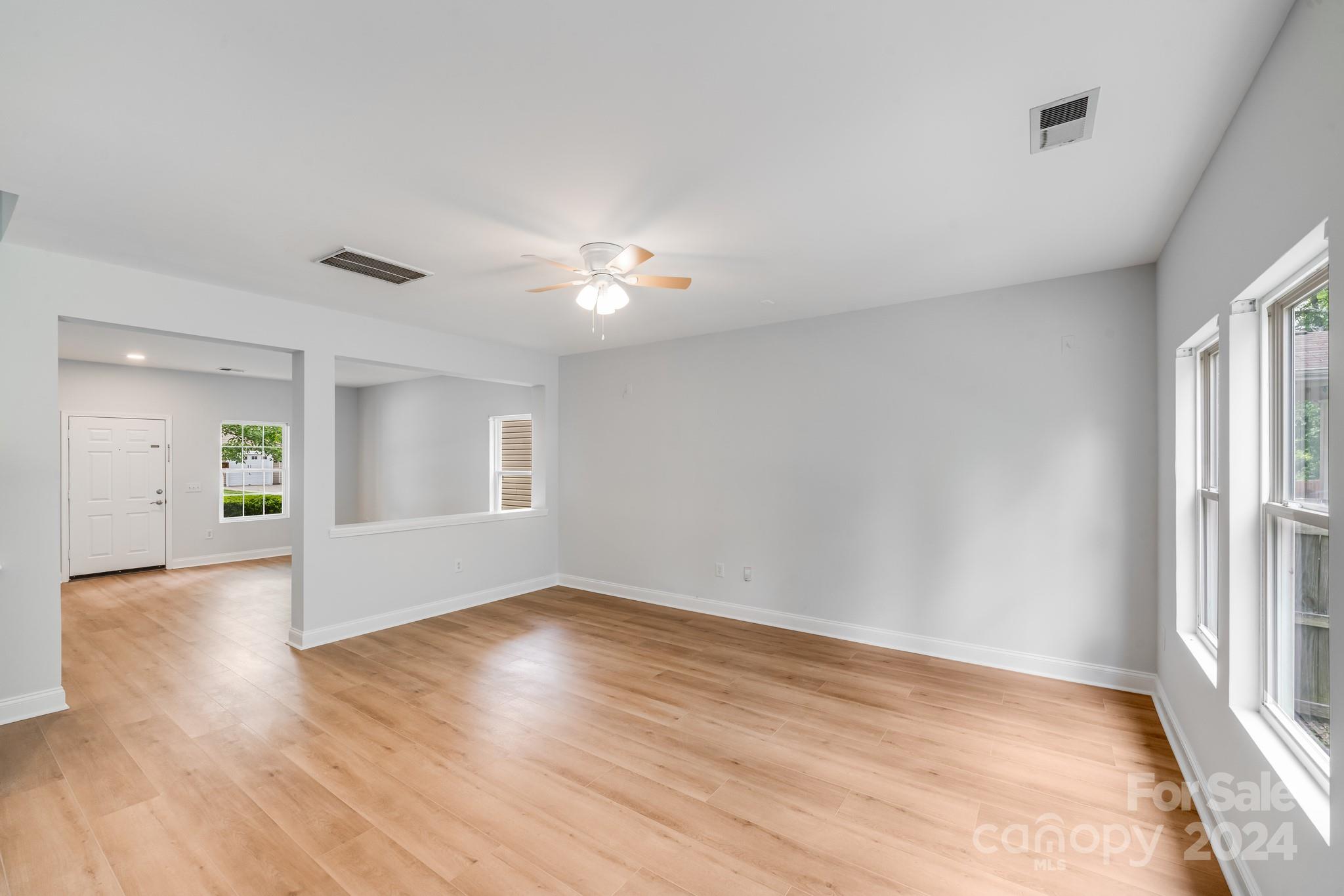 4420 Red Hook Road Monroe, NC 28110 - Photo 10 of 34 a view of empty room with wooden floor and fan