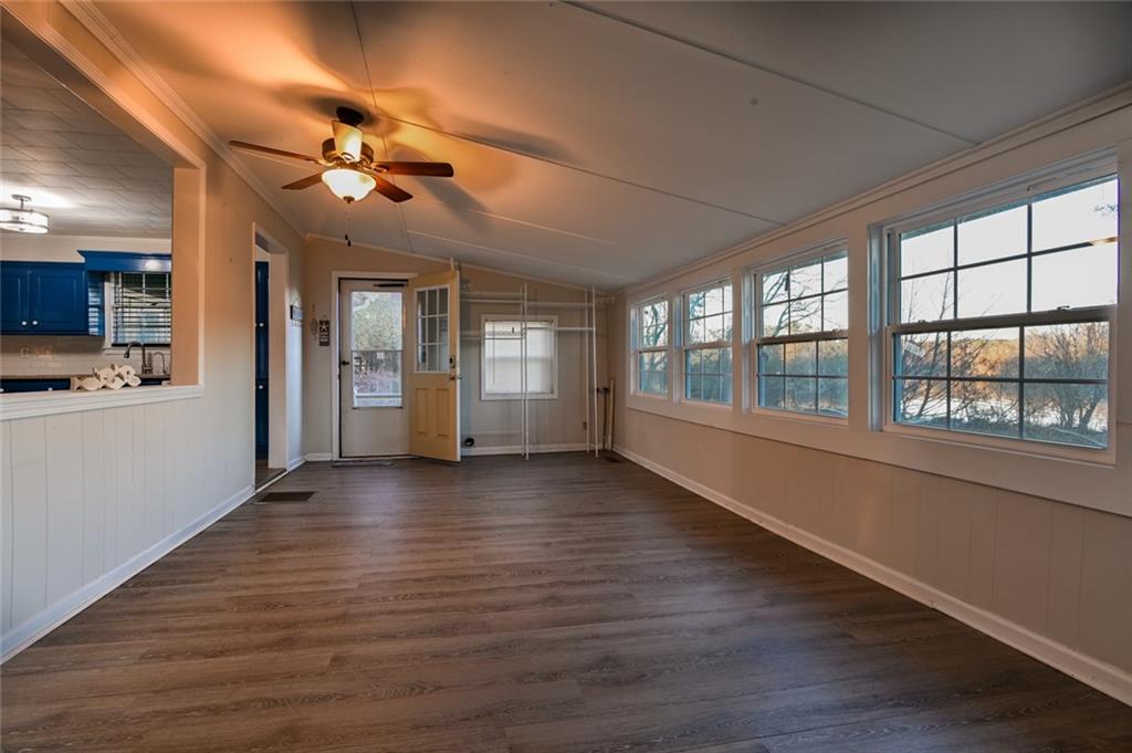 458 Haley Road Jackson, GA 30233 - Photo 4 of 47 a view of an empty room with wooden floor and a window