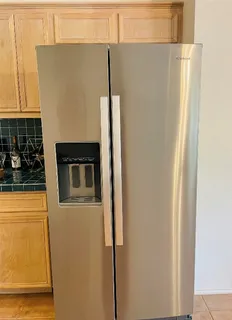 a blue refrigerator freezer sitting in a kitchen