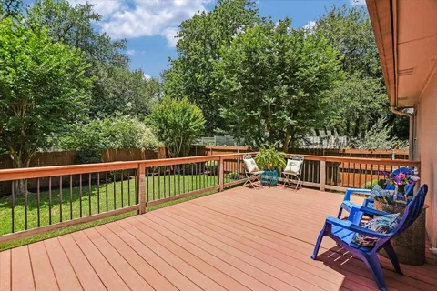 a view of balcony with deck and outdoor seating