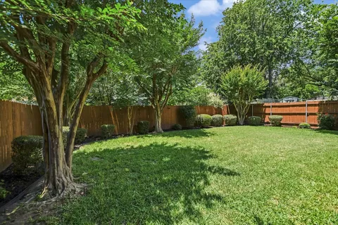 a balcony with wooden floor and outdoor space