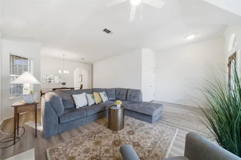 a living room with furniture and a rug