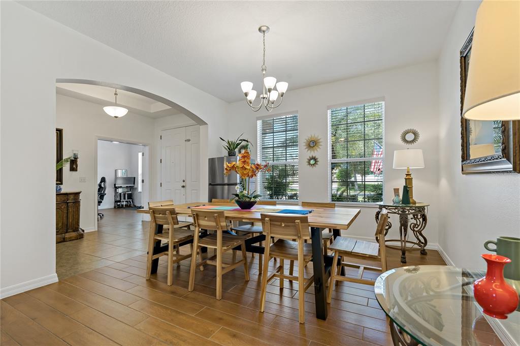 178 Magneta Loop Auburndale, FL 33823 - Photo 16 of 77 a view of a dining room with furniture window and wooden floor