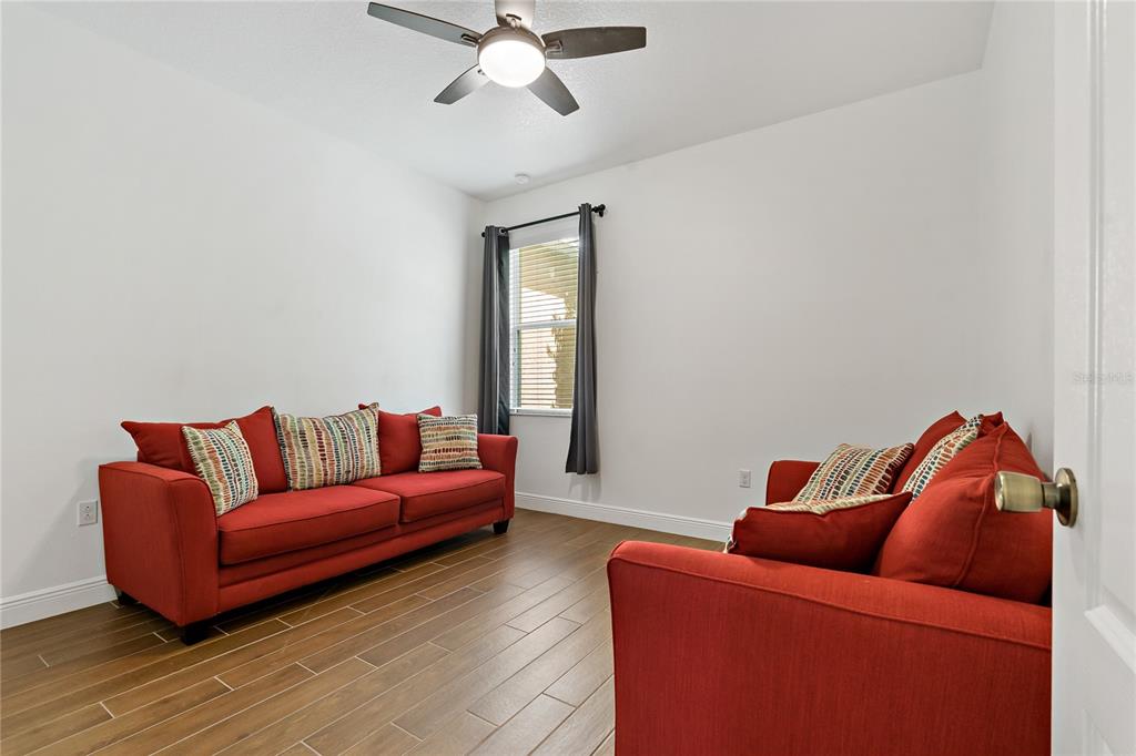 178 Magneta Loop Auburndale, FL 33823 - Photo 28 of 77 a living room with furniture and a window