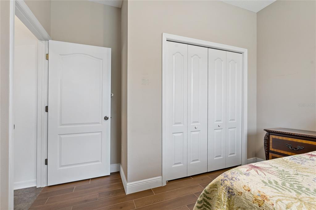 178 Magneta Loop Auburndale, FL 33823 - Photo 32 of 77 a view of a bedroom with wooden floor