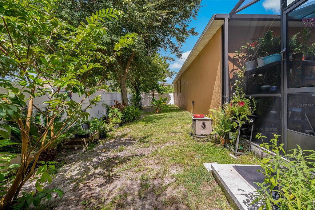 178 Magneta Loop Auburndale, FL 33823 - Photo 46 of 77 a view of a backyard with plants and a patio