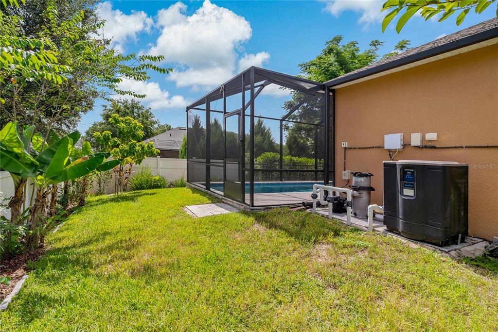 178 Magneta Loop Auburndale, FL 33823 - Photo 47 of 77 a view of a house with backyard and sitting area