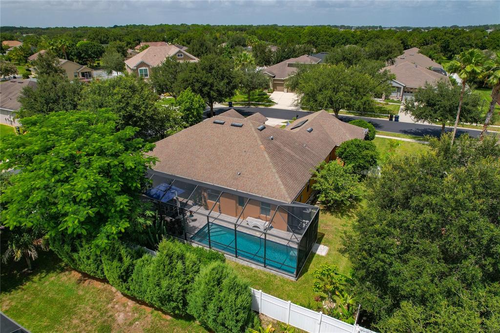 178 Magneta Loop Auburndale, FL 33823 - Photo 52 of 77 an aerial view of a house with a garden and lake view