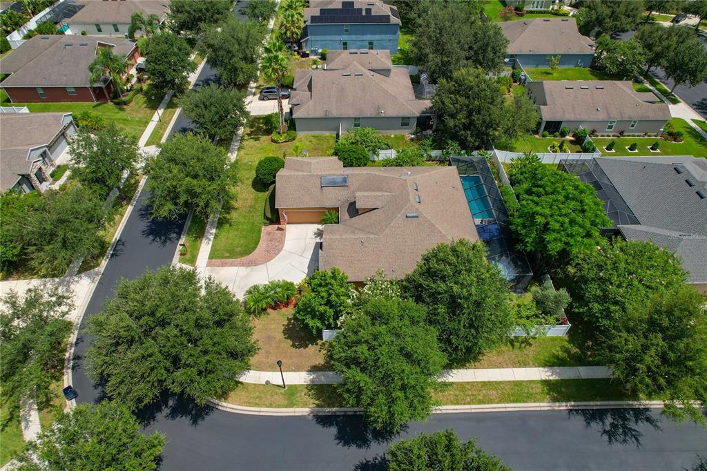 178 Magneta Loop Auburndale, FL 33823 - Photo 54 of 77 an aerial view of a house with a garden and a yard