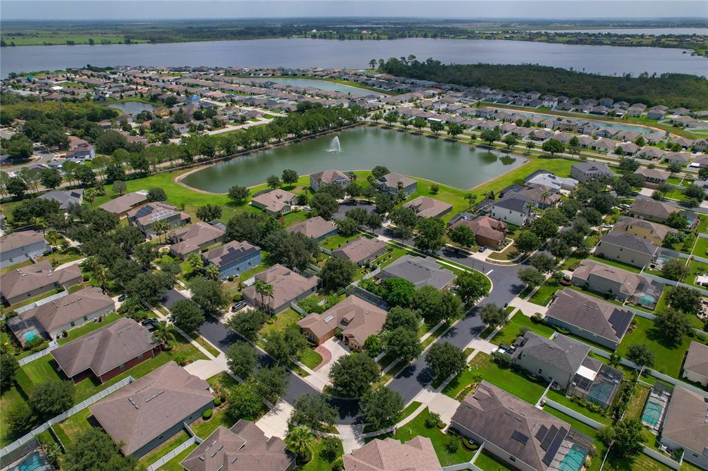 178 Magneta Loop Auburndale, FL 33823 - Photo 62 of 77 an aerial view of residential houses with outdoor space and lake view