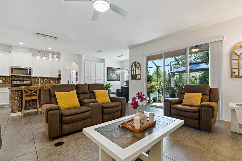 178 Magneta Loop Auburndale, FL 33823 - Photo 7 of 77 a living room with furniture kitchen and a large window
