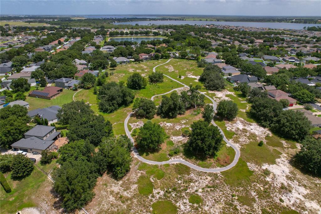 178 Magneta Loop Auburndale, FL 33823 - Photo 77 of 77 an aerial view of residential houses with outdoor space and trees