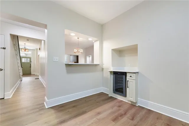 wooden floor in an empty room with a fireplace