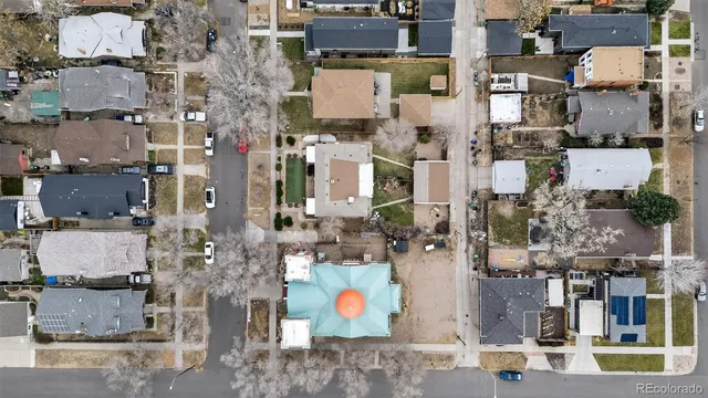 an aerial view of houses with outdoor space