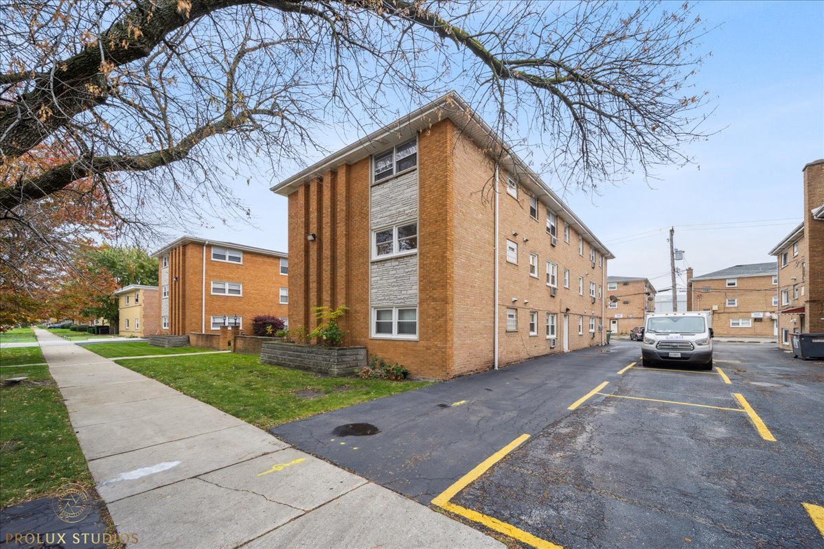 6935 West 64th Place, Unit 2A Chicago, IL 60638 - Photo 14 of 15 a view of a house with a yard