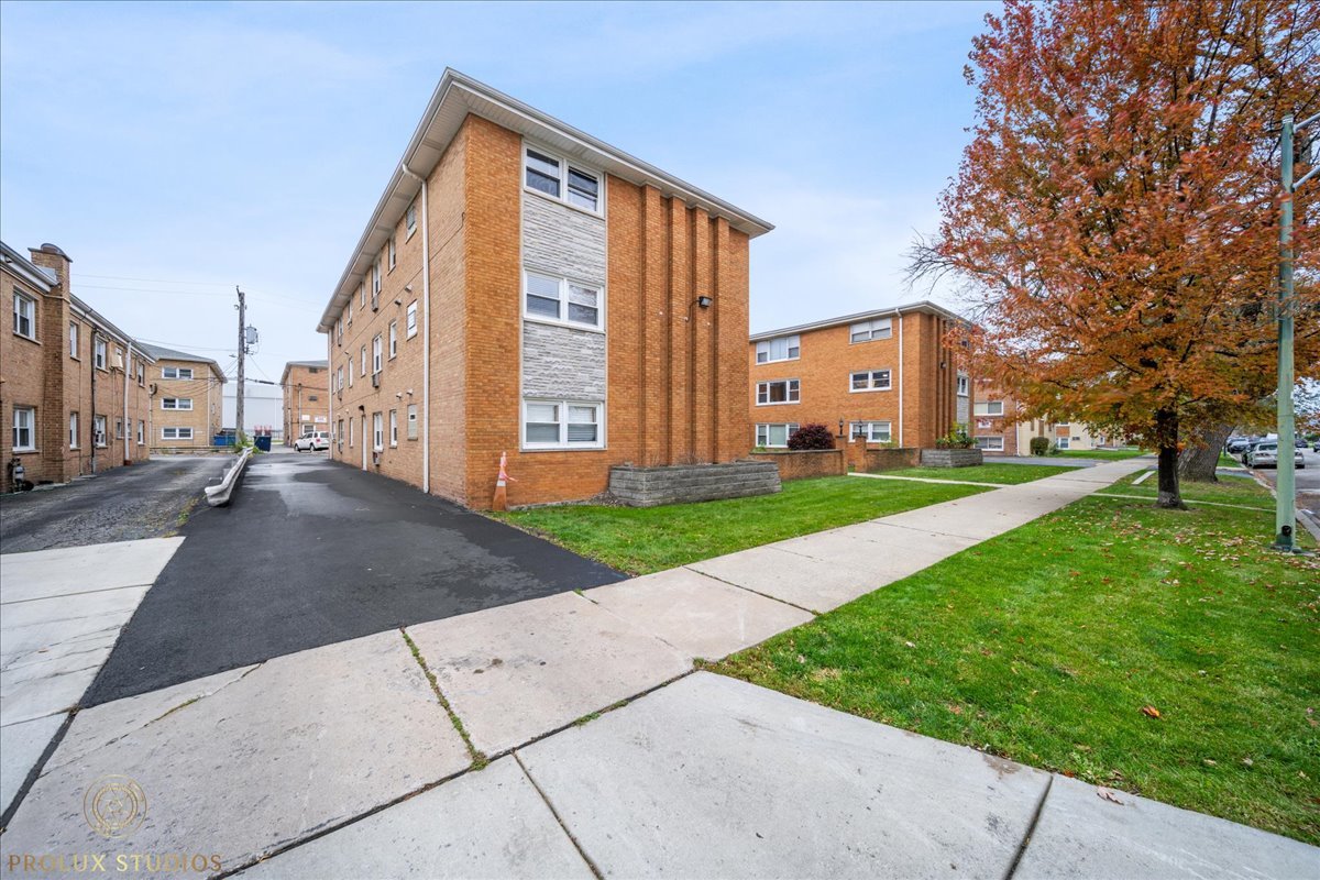 6935 West 64th Place, Unit 2A Chicago, IL 60638 - Photo 15 of 15 a view of a street with brick building in the background