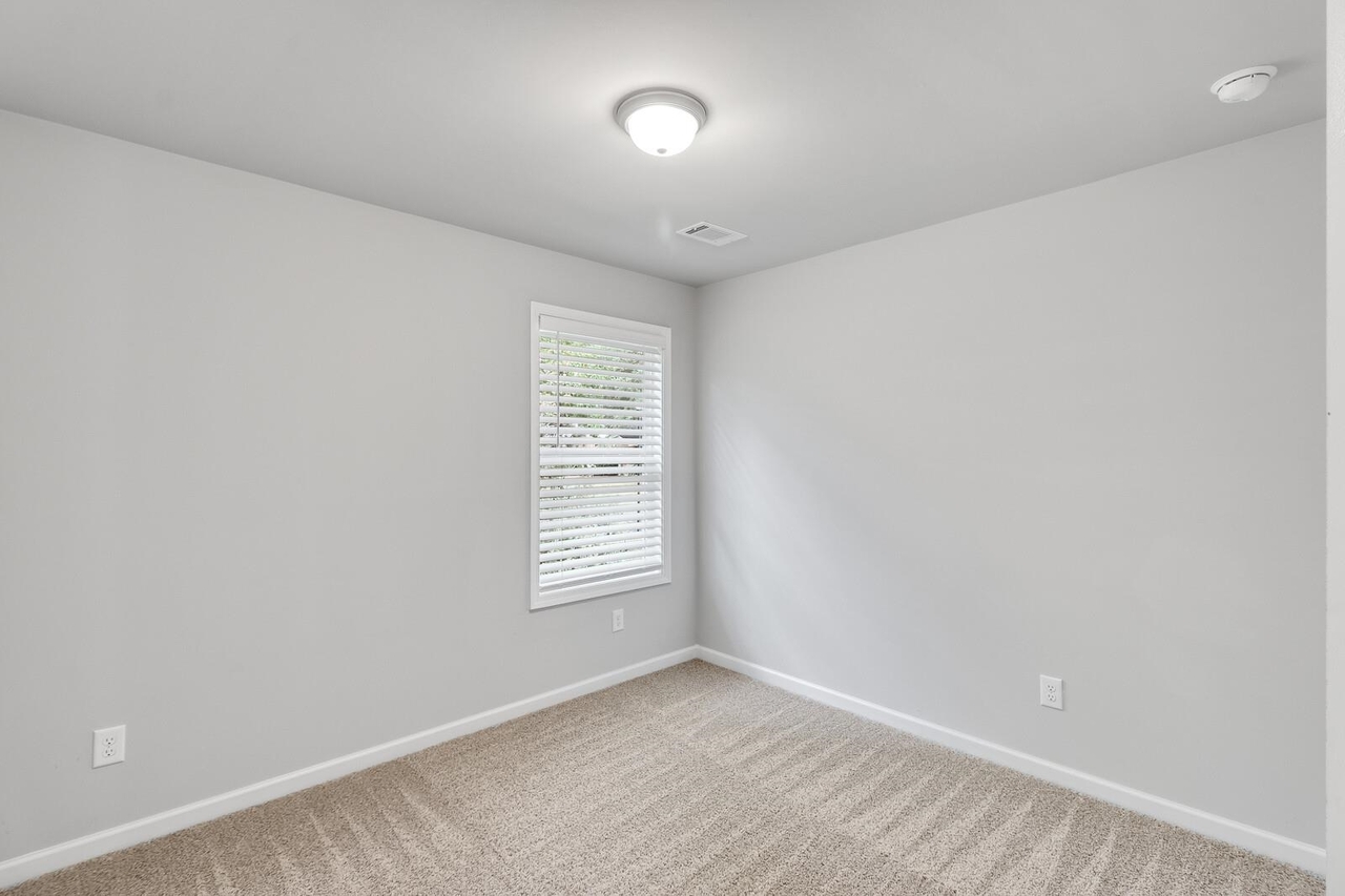 15 Sprayberry Road, Unit 11 Newnan, GA 30263 - Photo 9 of 18 an empty room with a window
