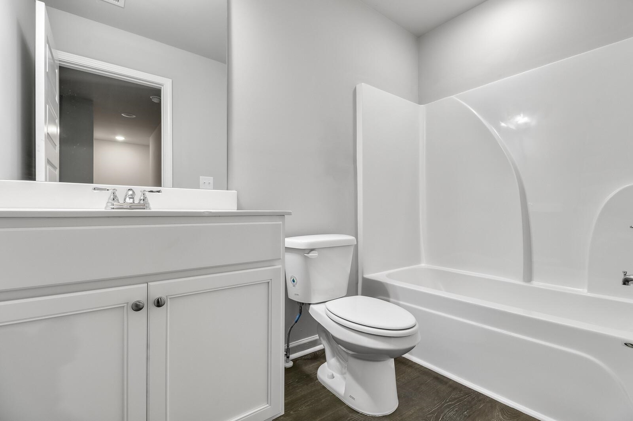 15 Sprayberry Road, Unit 11 Newnan, GA 30263 - Photo 10 of 18 a bathroom with a toilet sink and a bathtub