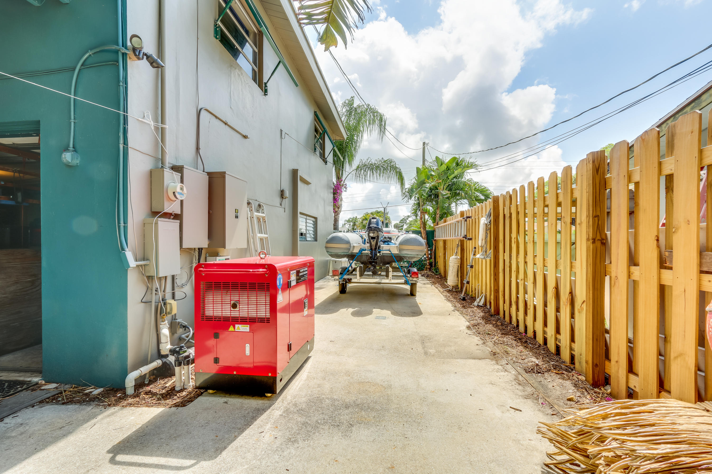 1811 High Ridge Road Lake Worth, FL 33461 - Photo 17 of 39 Side house/Generator