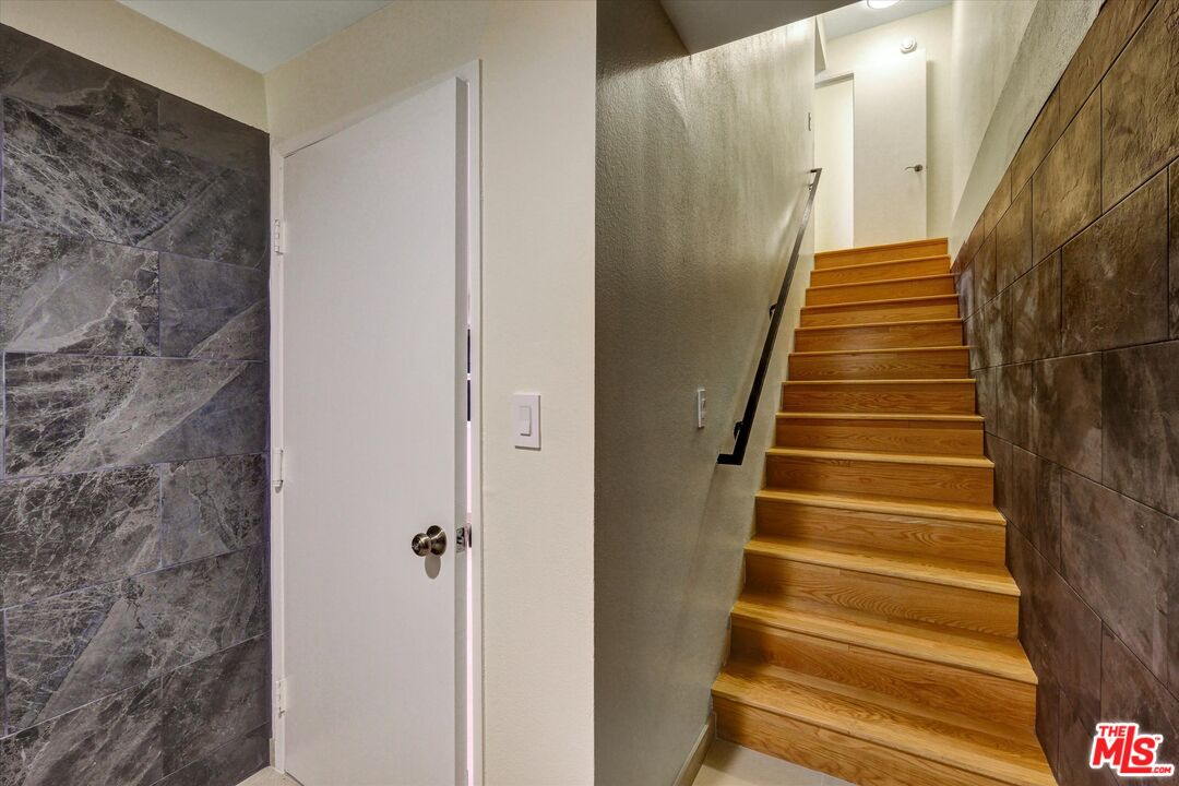 9634 Vía Rimini, Unit 118 Burbank, CA 91504 - Photo 27 of 35 a view of entryway with wooden floor