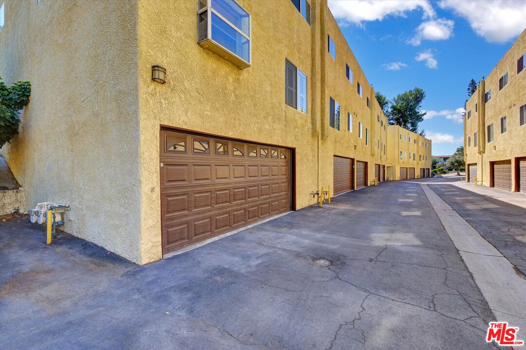 9634 Via Rimini, Unit 118 Sun Valley, CA 91504 - Photo 29 of 33 a view of a house with a street