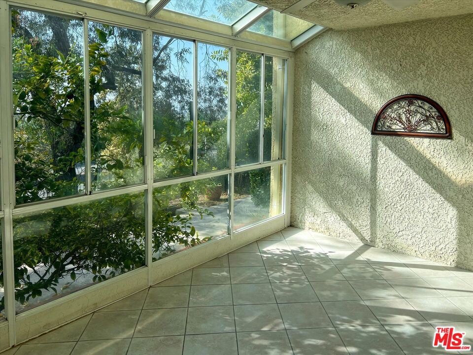 9634 Vía Rimini, Unit 118 Burbank, CA 91504 - Photo 4 of 35 a view of a door in the yard