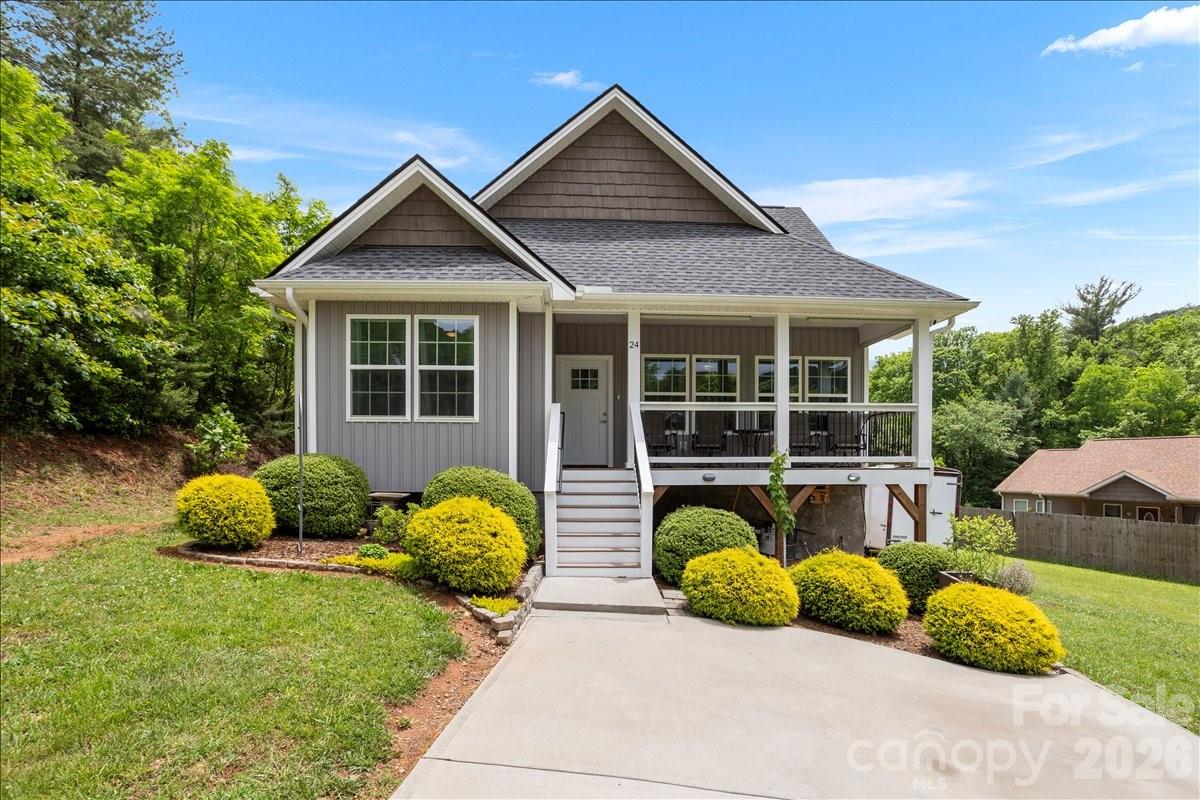 24 Mink Farm Road Leicester, NC 28748 - Photo 1 of 35 a front view of house with yard outdoor seating and green space