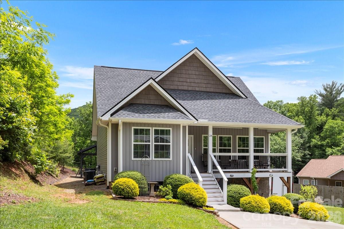 24 Mink Farm Road Leicester, NC 28748 - Photo 2 of 35 a front view of a house with patio