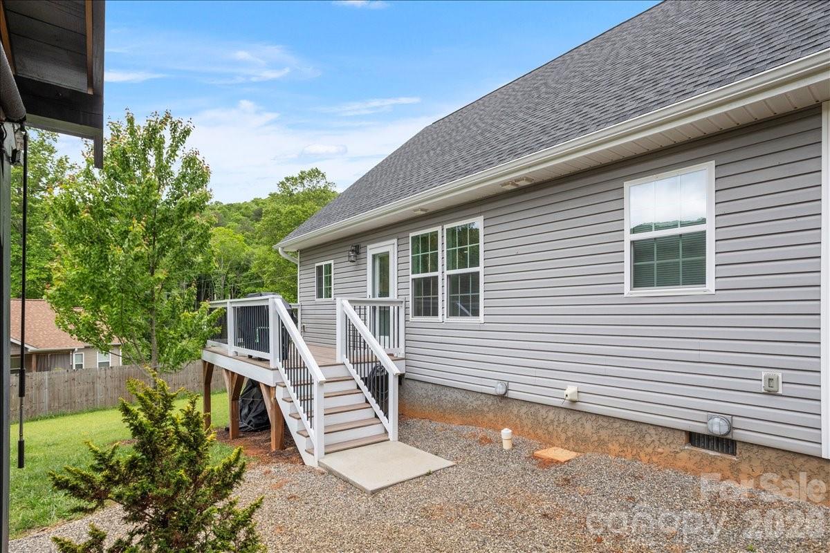 24 Mink Farm Road Leicester, NC 28748 - Photo 29 of 35 a view of a house with a yard and furniture