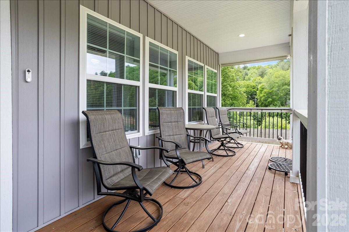 24 Mink Farm Road Leicester, NC 28748 - Photo 3 of 35 a view of balcony with wooden floor and furniture