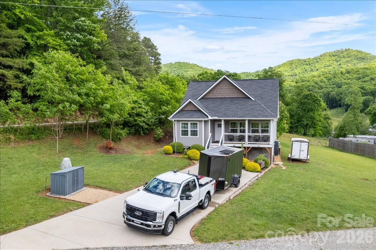 24 Mink Farm Road Leicester, NC 28748 - Photo 35 of 35 a aerial view of a house with swimming pool and a yard